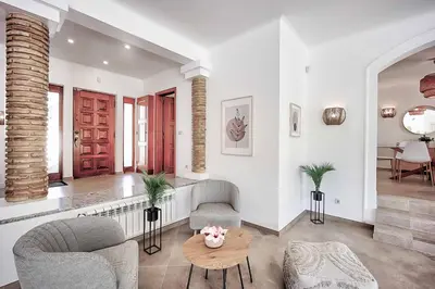 a living room with a couch and a table at Zen Balaia in Olhos de Água