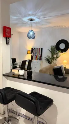 a living room with a couch and a table at Maple Apartment in Albufeira