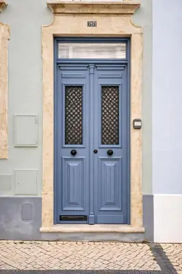 a blue door on the side of a building at Elegant City Center Loft in Faro