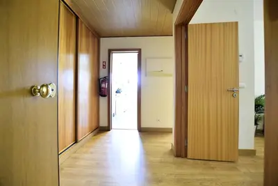 a hallway with a door leading to a room at Marina Sunny Heaven TatiHomes 2 in Albufeira