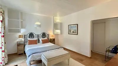 a bedroom with a bed and a desk and a window at Villa Morocco with Heated Private Pool for 12 Guests in Albufeira in Albufeira