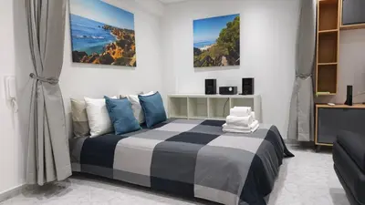 a bedroom with a bed and a couch at Linda Vista in Albufeira