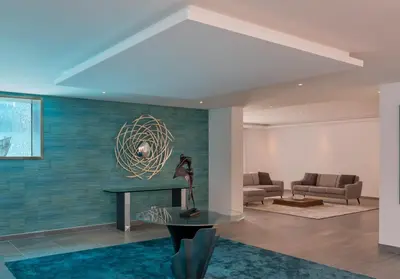 a living room with a couch and a fireplace at Stunning home with nice pool close to the beach in Loulé