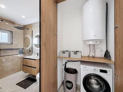 a kitchen with a washing machine in a bathroom at Albufeira prime stay 2 in Albufeira
