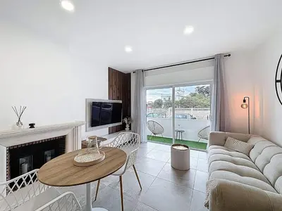 a living room with a couch and a table at Albufeira prime stay 2 in Albufeira