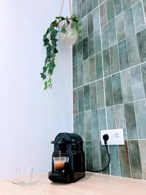 a toaster sitting on a table next to a wall at Apartamento T2 Moderno no Centro de Faro - ML - Market Tower in Faro