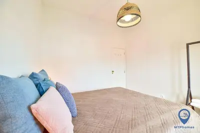 a bedroom with a bed with pillows on it at Eva Andorinha 5 Pax by MTPhomes in Albufeira