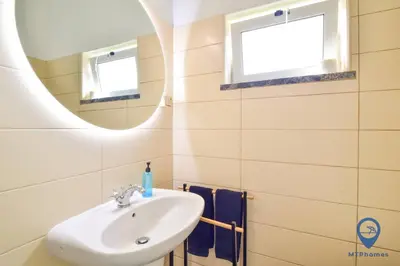 a bathroom with a sink and a mirror at Eva Andorinha 5 Pax by MTPhomes in Albufeira