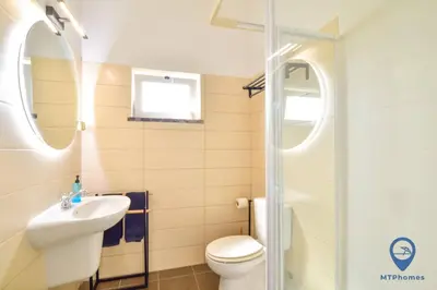 a bathroom with a toilet and a sink and a shower at Eva Andorinha 2 Pax by MTPhomes in Ferreiras