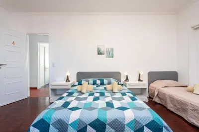 a bedroom with a bed with a blue at Blife Faya private apartment in FAO