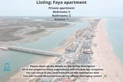 an aerial view of a beach with a pier at Blife Faya private apartment in FAO