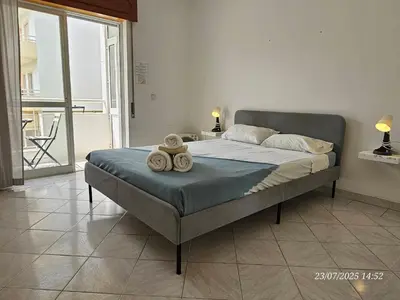 a bedroom with a bed with towels on it at Blife Allya private apartment in FAO
