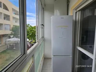a white refrigerator in a room with a window at Blife Allya private apartment in FAO