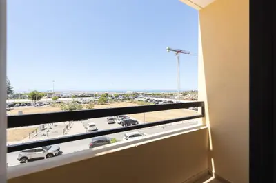 a window with a view of a parking lot at Dunas - Sea view near the beach by HD in Quarteira