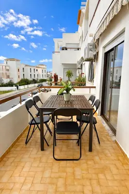 a balcony with white walls and a tile floor at Majesti Algarve Apartment in Albufeira