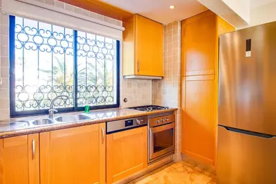 a bathroom with a tub and a sink and a mirror at Duplex Apartment with Pool, Balcony, Wi-Fi & AC in Vilamoura