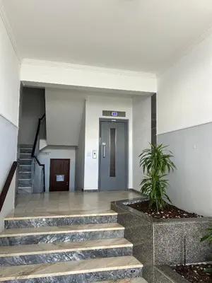 a staircase in a house with a wooden rail at 3F Bocage - Centro de Faro in Faro