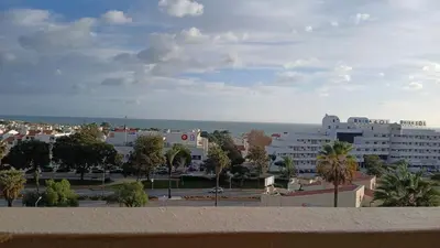 a bedroom with a bed in a room at Albufeira Apartment, Pool and Sea view in Albufeira