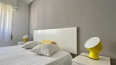 a kitchen with white cabinets and a counter top at Sea House Apartment - Private Condo with 4 Pools, Jacuzzi & Tennis Court in Albufeira