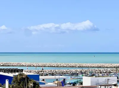 a view of a beach with a crowd of people at Blue Coast Penthouse T4 in Quarteira