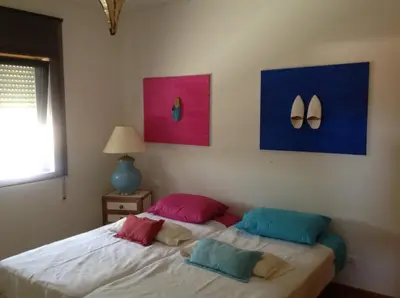 a bedroom with a bed with two pillows on it at Marina de Albufeira - Apartamentos Turísticos da Orada in Albufeira