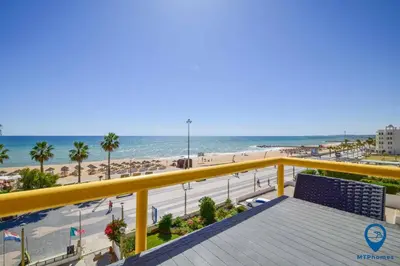 a view of the beach from the balcony of a condo at Praia Mar by MTPhomes in Quarteira