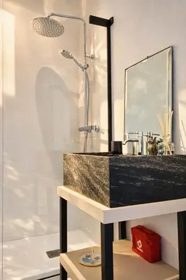a bathroom with a sink and a shower at Espaço Luzitano, fabulous and stylish spot, Faro city center, Wi-fi in Faro