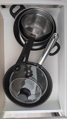 a group of pans and utensils in a drawer at Albufeira Spring, Summer & Fall in Albufeira