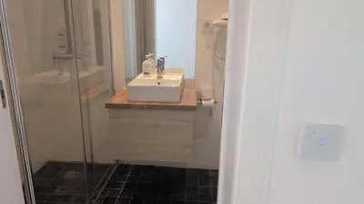 a bathroom with a sink and a shower at Albufeira Spring, Summer & Fall in Albufeira