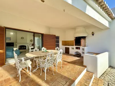 a dining room with a table and chairs at Vilamoura Summer Villa 2 With Pool by Homing in Vilamoura