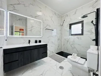 a white bathroom with a sink and a toilet at Vilamoura Summer Villa 2 With Pool by Homing in Vilamoura