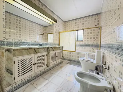 a bathroom with a toilet and a tub and a sink at Vilamoura Summer Villa 2 With Pool by Homing in Vilamoura