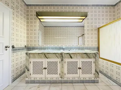 a bathroom with a large sink and a large mirror at Vilamoura Summer Villa 2 With Pool by Homing in Vilamoura