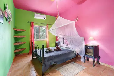 a bedroom with a bunk bed and a night stand at Quinta do Mocho in Alcaria