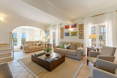 a living room with two couches and a coffee table at Monte Da Poupa - 7 bedroom villa - Sleeps 15 in Albufeira