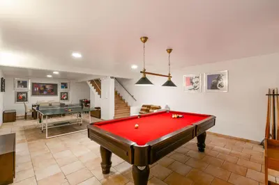 a room with a pool table and ping pong ball at Monte Da Poupa - 7 bedroom villa - Sleeps 15 in Albufeira