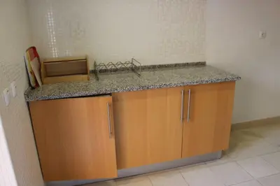 a kitchen with a sink and a counter top at Spacious apartment in Albufeira 200 m² with shared pool in Albufeira