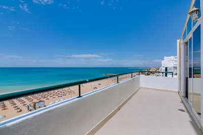 a balcony with a view of the ocean at Carteia Beachfront at Praia da Gaivota in Quarteira