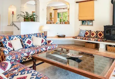 a living room with couches and a coffee table at Traditional property with pool nice large garden in FAO