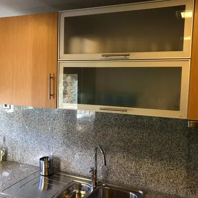 a kitchen with a sink and a microwave at Algarve Family Escape in Olhos de Água