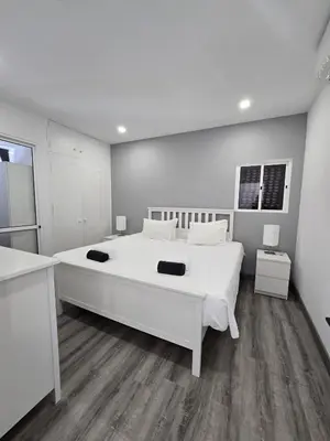 a large white bedroom with a large white bed at O Forte by MTPhomes in Albufeira
