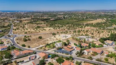 an aerial view of a town with a road at Greice Homes - Villa Carob Tree in Almancil