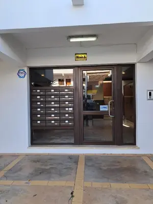 an entrance to an office with a glass door at T1 Perto Marina Praia Vilamoura in Vilamoura