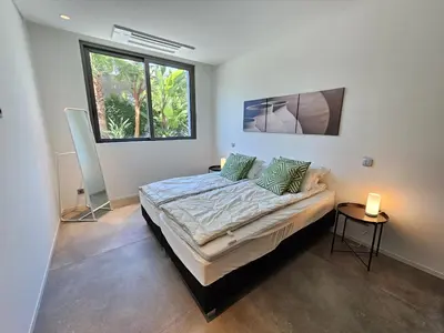 a bedroom with a bed and a window at Finisterra Deluxe in Albufeira