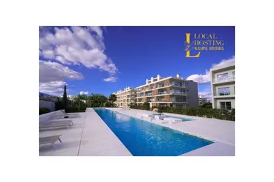 a view of a hotel with a swimming pool at Flat Green Garden by Localhosting in Albufeira