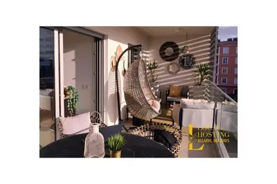 a room with a balcony with a view of a living room at Flat Green Garden by Localhosting in Albufeira