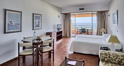 an aerial view of a resort and the ocean at Dom Pedro Portobelo in Quarteira