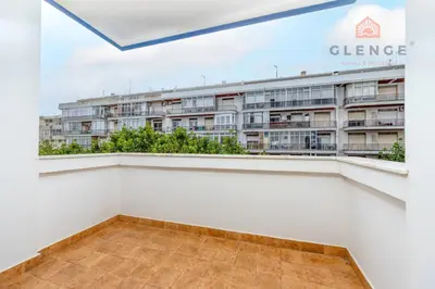 a balcony with a view of a building at Torre Mira Praia 2 Quartos by Glenge Holiday in Loulé