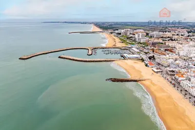 an aerial view of a beach and the ocean at Torre Mira Praia 2 Quartos by Glenge Holiday in Loulé