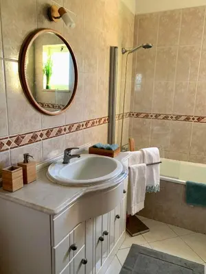 a bathroom with a sink and a mirror at C Dreams - Comfortable and luminous apartment in Albufeira